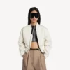 Naisten lyhyt bomber-taki, väri ivory Naisten lyhyt bomber-taki, väri ivory