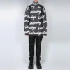 Scribble-logolla varustettu turtleneck-neulepusero ”Black” 625927T31801070